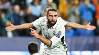 Real Madrid's Spanish defender Dani Carvajal celebrates after scoring the 3-2 goal at overtime during the Uefa Super Cup final football match between Real Madrid CF and Sevilla FC on August 9, 2016 at the Lerkendal Stadion in Trondheim. Jonathan Nackstrand / AFP