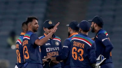 India's Prasidh Krishna, second left, and teammates celebrate their win in the first ODI against England in Pune. AP