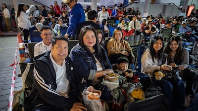 Maricris De Leon, centre, with her family and friends at Simbang Gabi at St Mary's Catholic Church