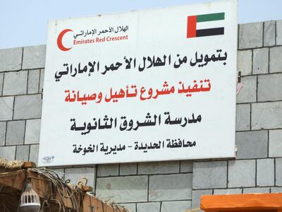 A sign in front of a secondary school that was repaired by the Emirates Red Crescent in the city of Al Khokha. It says that the project to repair and maintain the school is sponsored by the ERC. Ali Mahmood for The National