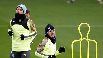 Manchester City's David Silva, right, during a team training session at the City Football Academy on Monday. PA