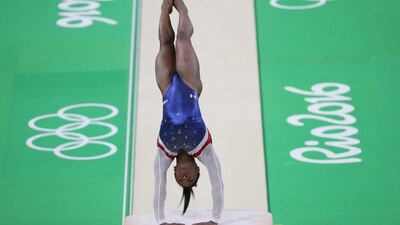 Simone Biles of the USA competes on the uneven bars in women’s gymnastics individual all-around final at the 2016 Rio Olympics at Rio Olympic Arena on August 11, 2016 in Rio de Janeiro, Brazil. How Hwee Young / EPA