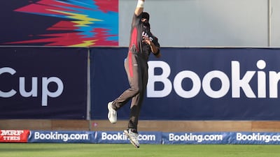 UAE's Rameez Shahzad of the UAE catches out George Munsey of Scotland. Chris Whiteoak / The National