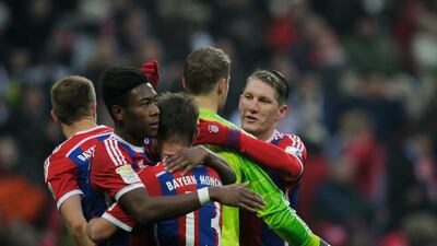 Sebastian Schweinsteiger congratulates Manuel Neuer of FC Bayern after victory in the Bundesliga match between FC Bayern Muenchen and Hamburger SV - at Allianz Arena on February 14, 2015 in Munich, Germany. (Photo by Adam Pretty/Bongarts/Getty Images)