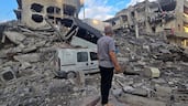 A man searches the debris of a building in the southern Lebanese coastal city of Tyre on May 23, 2026, after an Israeli attack. Two buildings in and around Tyre were bombed overnight on May 22 into May 23, after the Israeli military threatened residents to leave. AFP