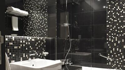 A bathroom in one of the serviced hotel apartments at Damac Maison in Downtown Dubai. Jeff Topping for The National