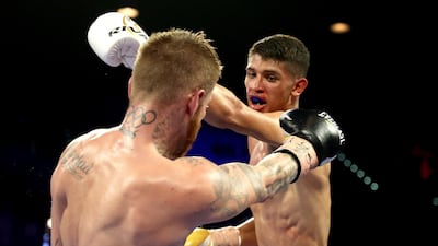 Sebastian Fundora (R) punches Daniel Lewis during their junior middleweight bout at MGM Grand Garden Arena in Las Vegas. AFP