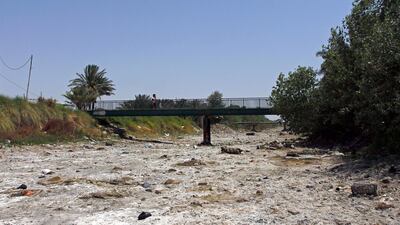 This picture shows an empty riverbed in Umm Abbasiyat, some 60 kilometers east of Najaf, on July 5, 2018. AFP