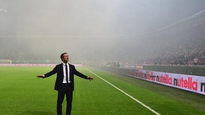 Croatia coach Niko Kovac appeals to Croatia fans to stop throwing flairs during Sunday's Euro 2016 qualifying match with Italy at the San Siro in Milan. Giuseppe Cacace / AFP