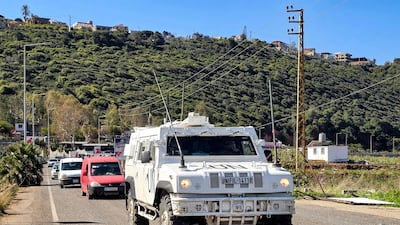 Vehicles of the UN peacekeeping force in south Lebanon escort a convoy of residents leaving the Christian village of Alma Al Chaab. AFP