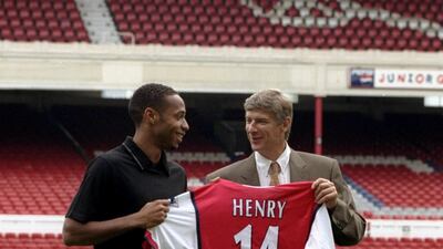 Arsene Wenger alongside new signing Thierry Henry at Highbury on August 3, 1999. Getty