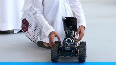 Saeed Al Yammahi checks on his design of a tele-operated mobile robot at the Ebtikar Innovation contest at the Petroleum Institute in April. Ravindranath K / The National