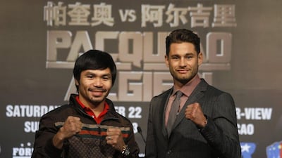 Manny Pacquiao, left, and Chris Algieri, right, pose during a news conference in Macau on Monday ahead of their November fight in the Chinese city. Bobby Yip / Reuters / August 25, 2014