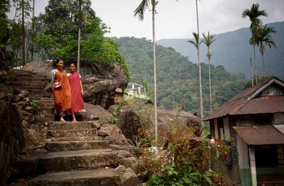 A young woman leaves after casting her vote at a remote polling station in Nongriat village in the northeastern state of Meghalaya, India. Reuters