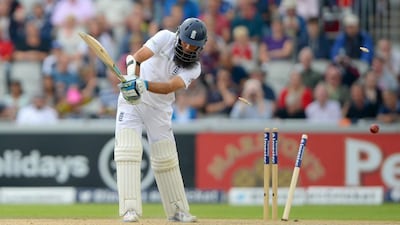 MANCHESTER, ENGLAND - AUGUST 08: Moeen Ali of England is bowled by Varun Aaron of India during day two of 4th Investec Test match between England and India at Old Trafford on August 8, 2014 in Manchester, England. (Photo by Gareth Copley/Getty Images)