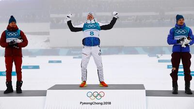 Gold medallist Iivo Niskanen of Finland reacts during the medals ceremony at the Winter Olympics. Kai Pfaffenbach / Reuters
