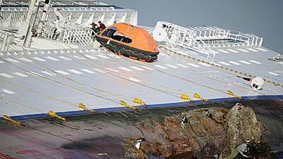 Rescuers search the Costa Concordia for more survivors yesterday.