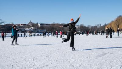 People skate and walk on frozen Landwehr Canal in the Kreuzberg district during the second wave of the coronavirus pandemic in Berlin, Germany. Getty