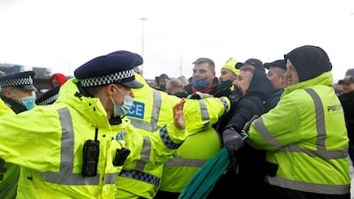 Police officers at Dover scuffle with drivers trying to stop trucks leaving until they are allowed to travel to Europe. Reuters