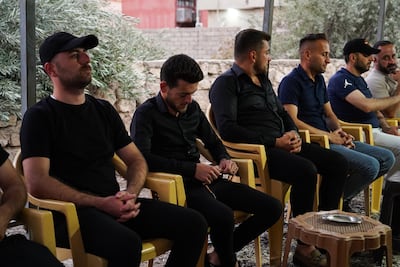 Steven Nabil, second from left, fiance of Maryam Moatasem, who died in the wedding hall fire, attends her funeral in Qaraqosh, northern Iraq. Ismael Adnan for The National