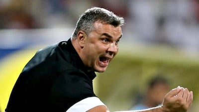 Al Ahli coach Cosmin Olaroiu reacts during the Arabian Gulf League match against Al Wasl at the Zabeel Stadium on December 15, 2013, in Dubai. Francois Nel / Getty Images