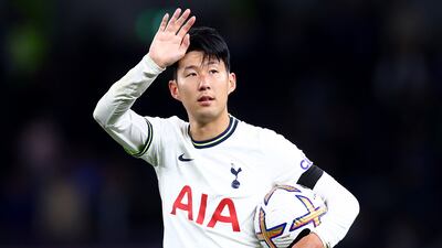 Son Heung-min of Tottenham Hotspur celebrates the 6-2 victory over Leicester with the hat-trick match ball at Tottenham Hotspur Stadium on September 17, 2022. Getty