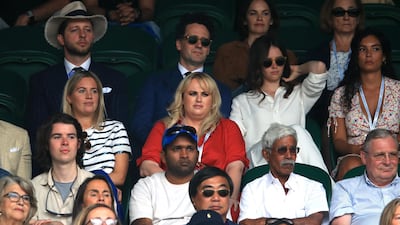 Rebel Wilson, centre, wearing Ralph Lauren, on day seven of the Wimbledon Championships at the All England Lawn Tennis and Croquet Club. PA