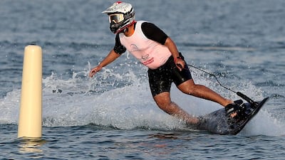 People compete in the flyboard section of the Dubai Watersports Summer Week.