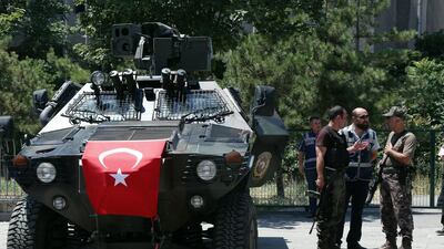 Turkish security officers stand outside an Ankara courthouse on July 18, 2016, where prosecutors were questioning 27 generals suspected of being involved in the failed coup. Burhan Ozbilici/AP Photo