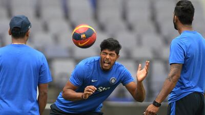 India's Umesh Yadav heads a football during a training session ahead of the third Test cricket match between India and South Africa at The Vidarbha Cricket Association Stadium in Nagpur on November 24, 2015. AFP PHOTO / Indranil MUKHERJEE---- IMAGE RESTRICTED TO EDITORIAL USE - STRICTLY NO COMMERCIAL USE ----