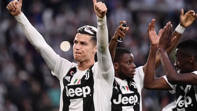 Cristiano Ronaldo acknowledges fans as Juventus celebrate winning the Serie A title. AFP