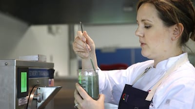 Christina Olivarez, a corporate executive chef at GNT, prepares to add a plant-based natural food colouring to ice cream. Seth Wenig / AP Photo