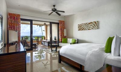 A king grand deluxe room at Doubletree by Hilton Seychelles Allamanda Resort & Spa comes with a Jacuzzi on the balcony. Courtesy Doubletree by Hilton Seychelles Allamanda Resort & Spa