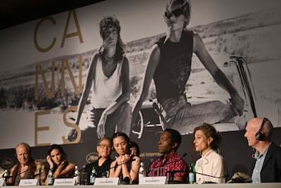 From left, jury members Stellan Skarsgard, Demi Moore, Park Chan-wook, Chloe Zhao, Isaach de Bankole, Laura Wandel and Paul Laverty at a press conference during the Cannes Film Festival on May 12. EPA