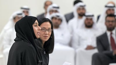 Hessa Essa Buhumaid, UAE Minister of Community Development (left), speaks during a lecture by Angela Duckworth (right), titled ‘True Grit: The Surprising, and Inspiring Science of Success’, at Majlis Mohamed bin Zayed. Rashed Al Mansoori / Crown Prince Court - Abu Dhabi