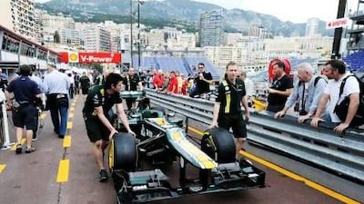 Caterham mechanics wheel one of their cars down the pit lane yesterday on the unmistakably tight Circuit de Monaco ahead of Sunday’s race.