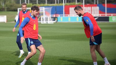 England's John Stones and Jordan Henderson, right, during a training session at St. George's Park on Thursday September 22, 2022. England take on Italy in the Nations League on Friday. PA