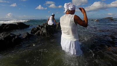 Worshippers take part in the traditional ceremony of Iemanja, the goddess of the sea of the Afro-Brazilian religion Umbanda, at the Rio Vermelho neighborhood in Brazil. AFP