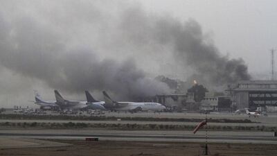 Smoke billows from Jinnah International Airport in Karachi June 9, 2014. Gunmen attacked one of Pakistan’s biggest airports on Sunday and at least 23 people were killed, including all 10 of the attackers, media reported. Athar Hussain / Reuters