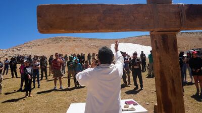 Maronite Christians attend a mass celebrated by Father Hani Tawk on Qornet Al Sawda on August 9, 2020.