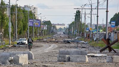 A damaged street on the outskirts of Kharkiv. EPA