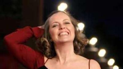 "She gives that dazzling smile that is impossible to resist."