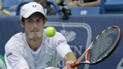 Andy Murray returns a serve against Ivo Karlovic during his semi-final victory in Cincinnati.