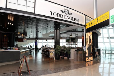 Visitors can access a range of dining options, including the Todd English Global Food Hall & Pub at the Zayed International Airport in Abu Dhabi. Pawan Singh / The National