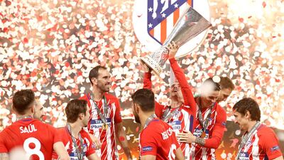 Atletico Madrid players celebrate with the trophy after winning the UEFA Europa League final between Olympique Marseille and Atletico Madrid in Lyon, France, on May 16, 2018. Atletico won 3-0. Yoan Valat / EPA