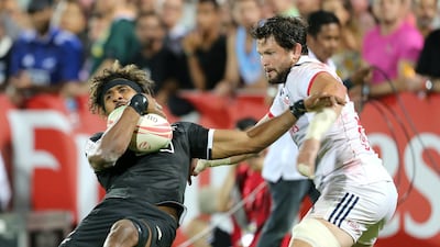 Masirewa in action with Danny Barrett of the US. Reuters