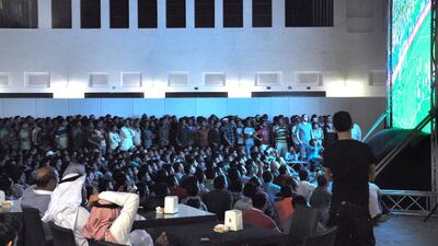 Football fans watch the opening match of World Cup 2014 between Croatia and the host country Brazil on June 12, 2014, in Doha, Qatar. Lauren Williams for The National