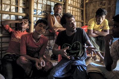 Rohingya men discuss their desire for justice in the refugee camp near Cox's Bazar, Bangladesh on August 14 2018. Campbell MacDiarmid for The National