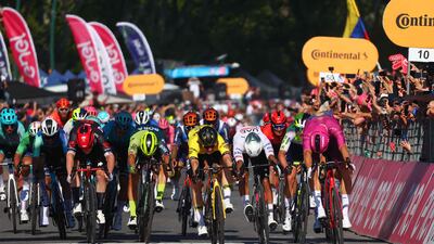 Team Visma's Dutch rider Olav Kooij, centre, sprints to the line to win the stage. AFP