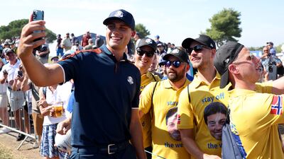 Europe's Ludvig Aberg poses for a selfie with fans during a practice round prior to the 2023 Ryder Cup at Marco Simone Golf Club. Getty